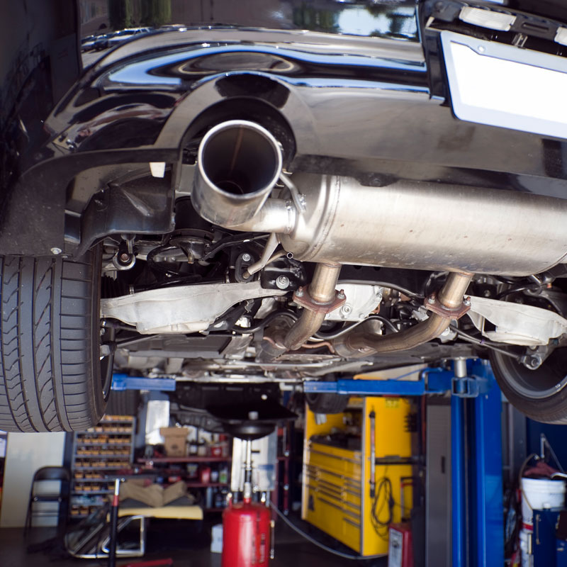 car lifted in auto garage